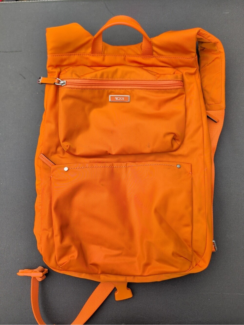 Tumi Orange Nylon Lightweight Backpack Needs Cleaned